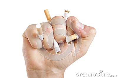 Manâ€™s hand crushing cigarettes Stock Photo